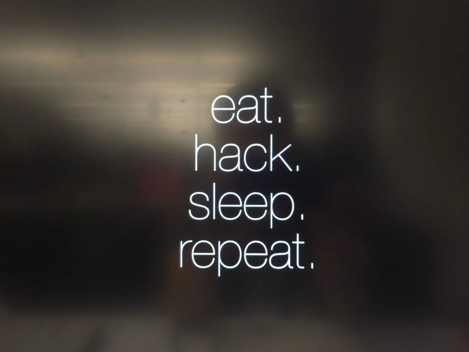 An eat, hack, sleep, repeat sign at the event