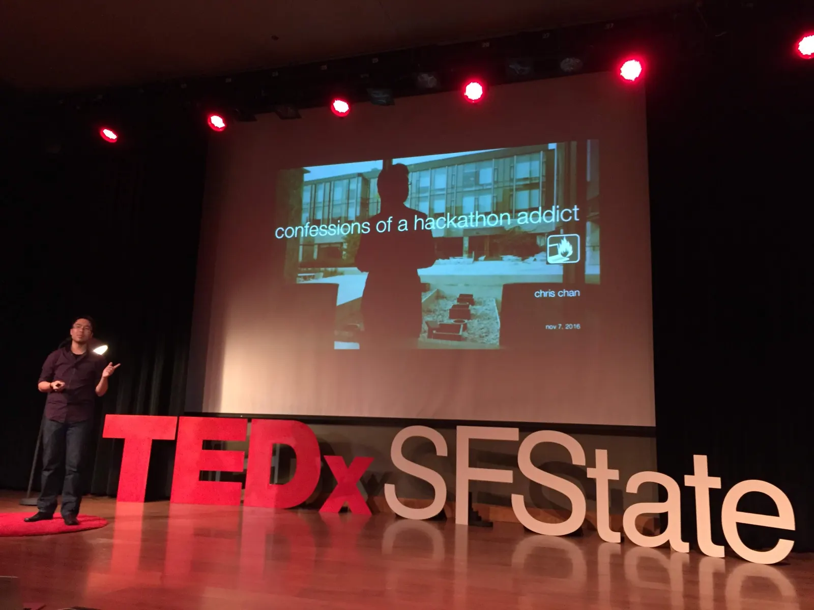Chris Chan speaking on the TEDxSFState stage